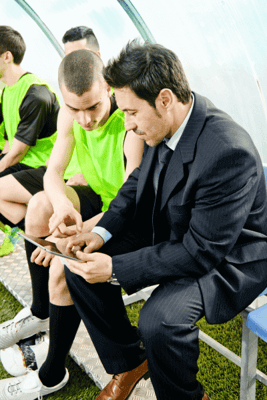  A teacher recording an incident using a mobile device