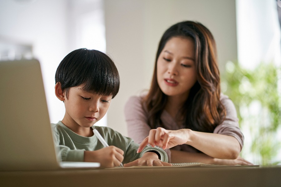 Parent helping child with ADHD study.